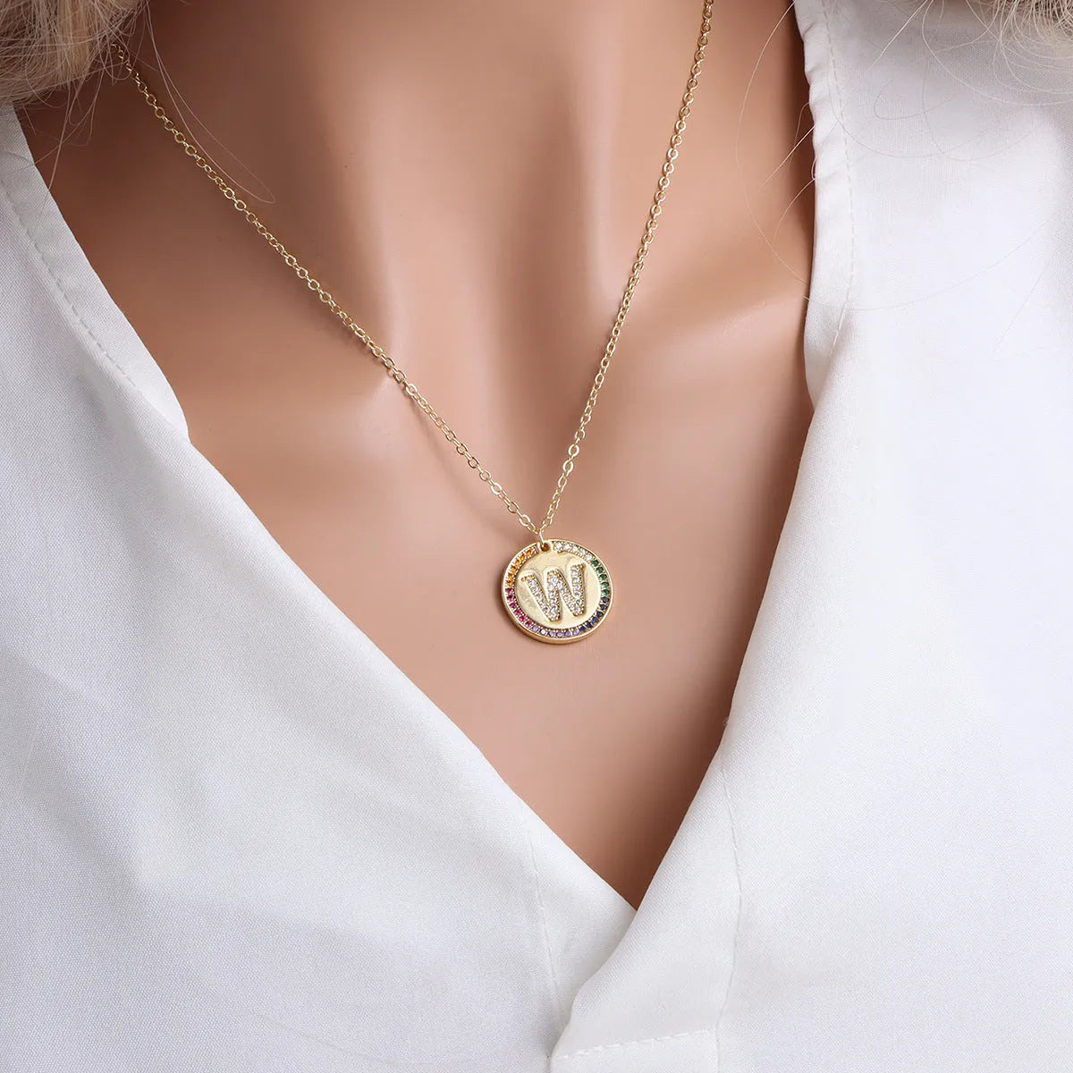Gold English letter round pendant necklace with colourful crystals on clavicle length chain