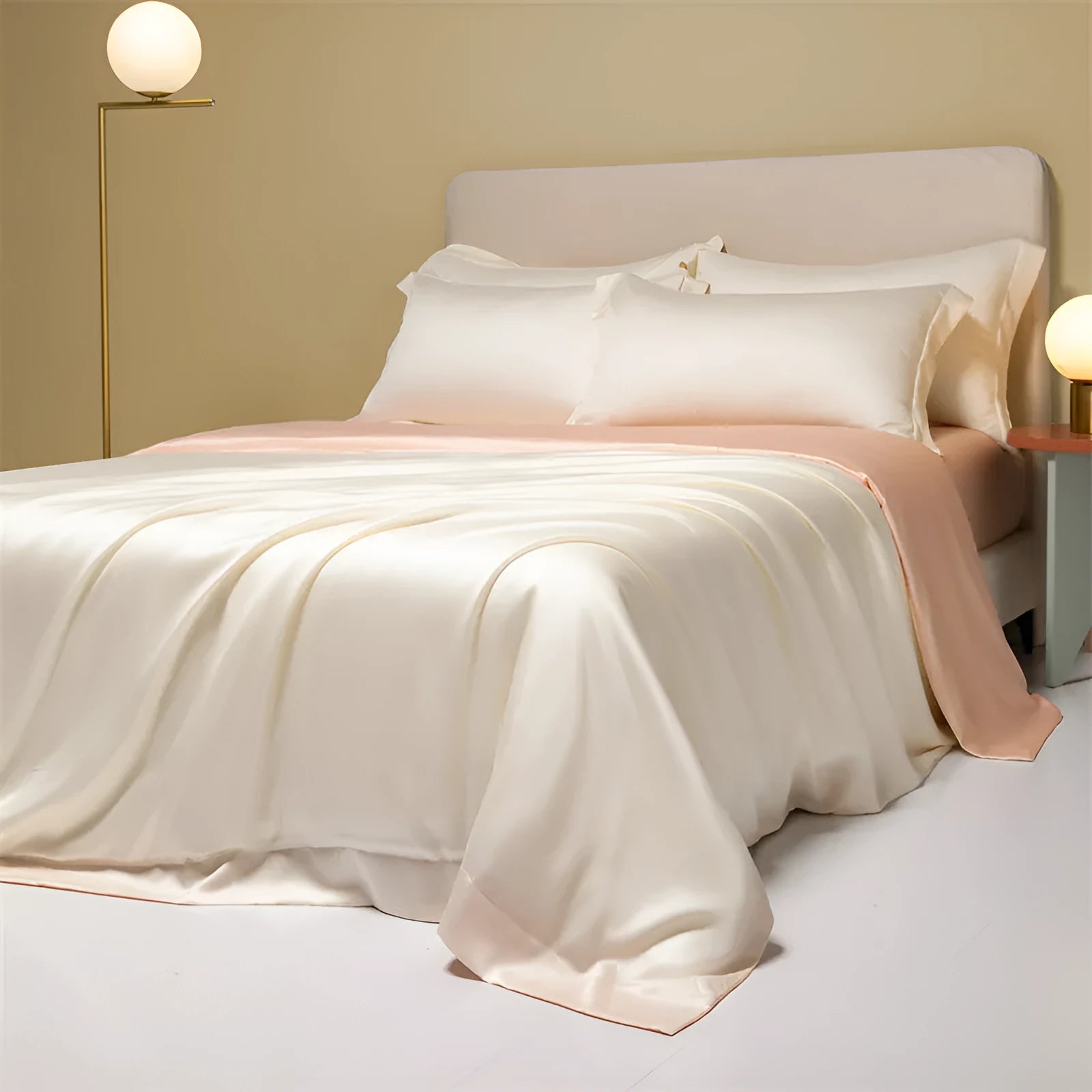 A modern, neatly made bed with a Lenzing Tencel duvet cover and pillowcases in a choice of nine colours like Sea Salt Blue.
