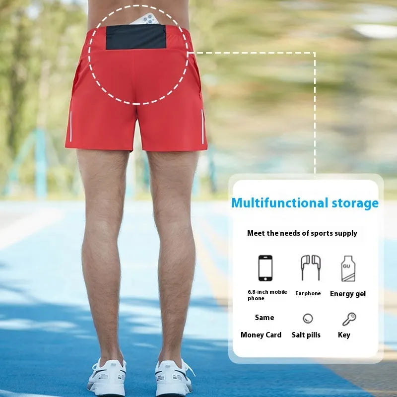 Man's high-waist loose fit off-road running shorts in black, showing quick-dry fabric and inner lining detail.