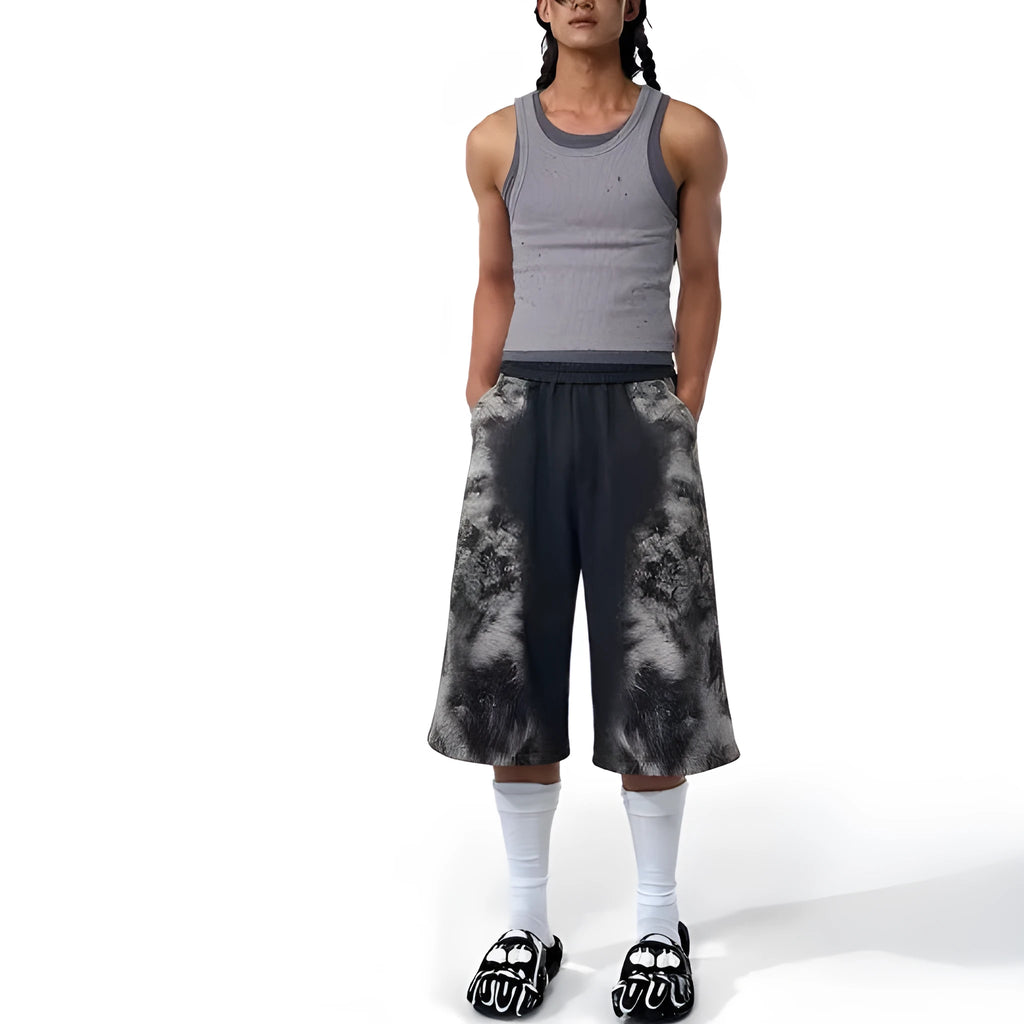 Women's grey loose-fit co-ord set with collage-stitch hoodie, matching trousers, and seven-inch shorts on a hanger.