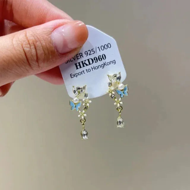 Geometric heart shaped rhinestone ear clips with star and tassel decoration on electroplated alloy