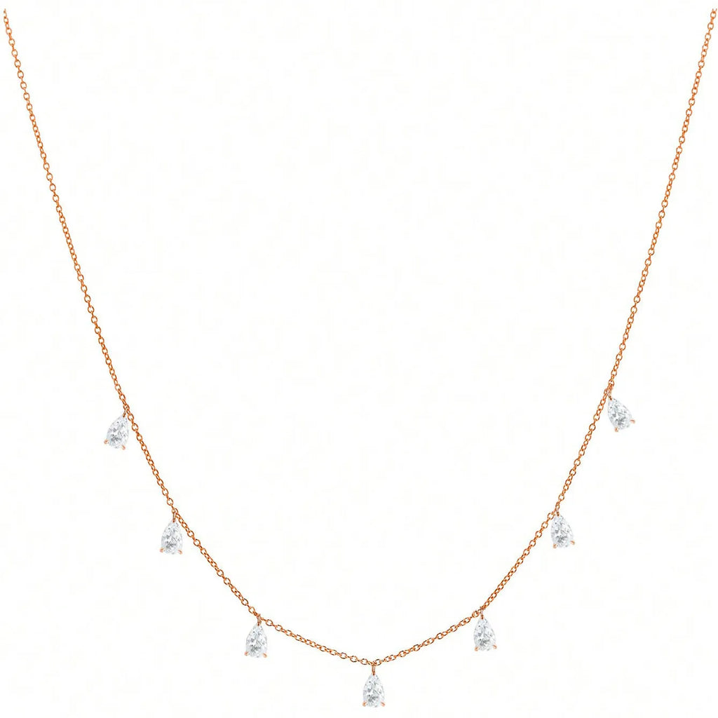 Women's silver necklace with a drop-shaped zircon pendant on an O-shaped chain, shown in golden yellow.