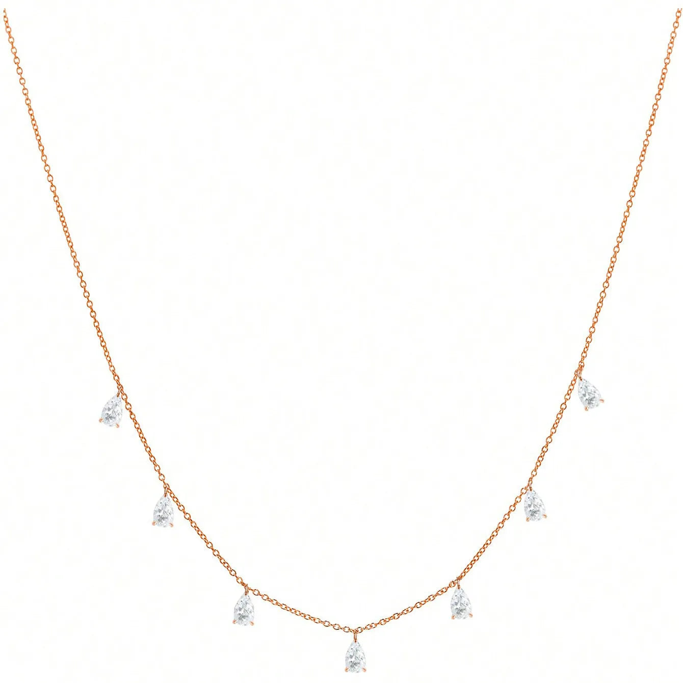 Women's silver necklace with a drop-shaped zircon pendant on an O-shaped chain, shown in golden yellow.