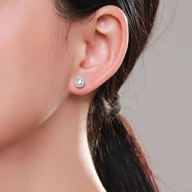 Women's silver water drop ear studs in 925 sterling silver with diamond treatment finish