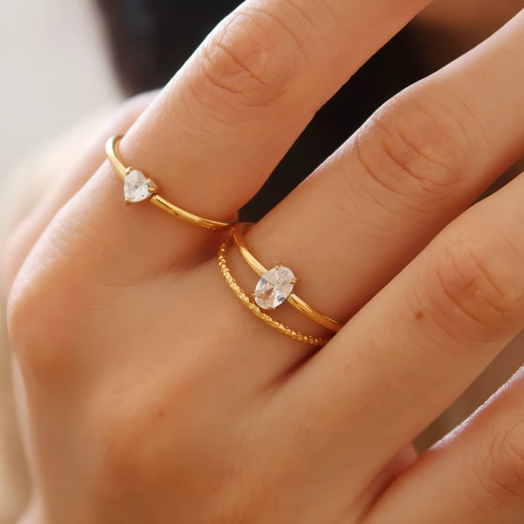 Simple golden electroplated stainless steel heart ring for women, shown in UK sizes 6, 7, 8.