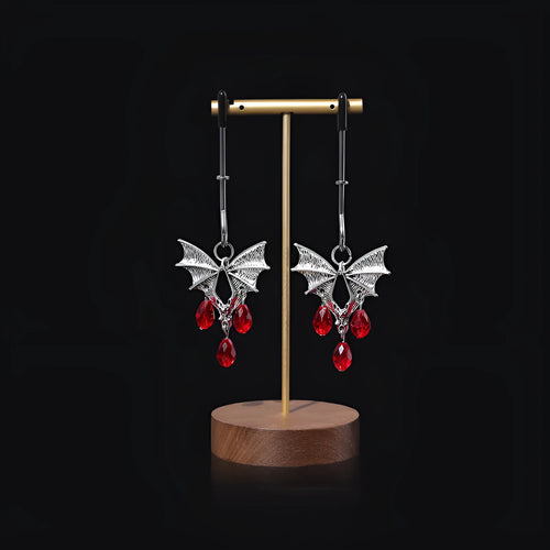 Silver bat nipple clamp with ruby design and adjustable pressure mechanism