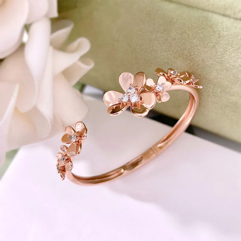 Three-leaf flower bracelet with micro inlaid zircon stones, copper base, electroplated in gold, silver, or rose gold