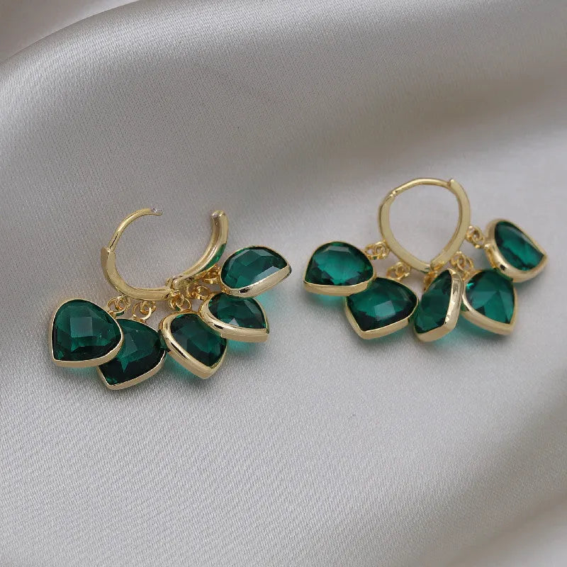 Green heart-shaped glass pendant ear clip earrings with alloy gemstone inlays on copper frame