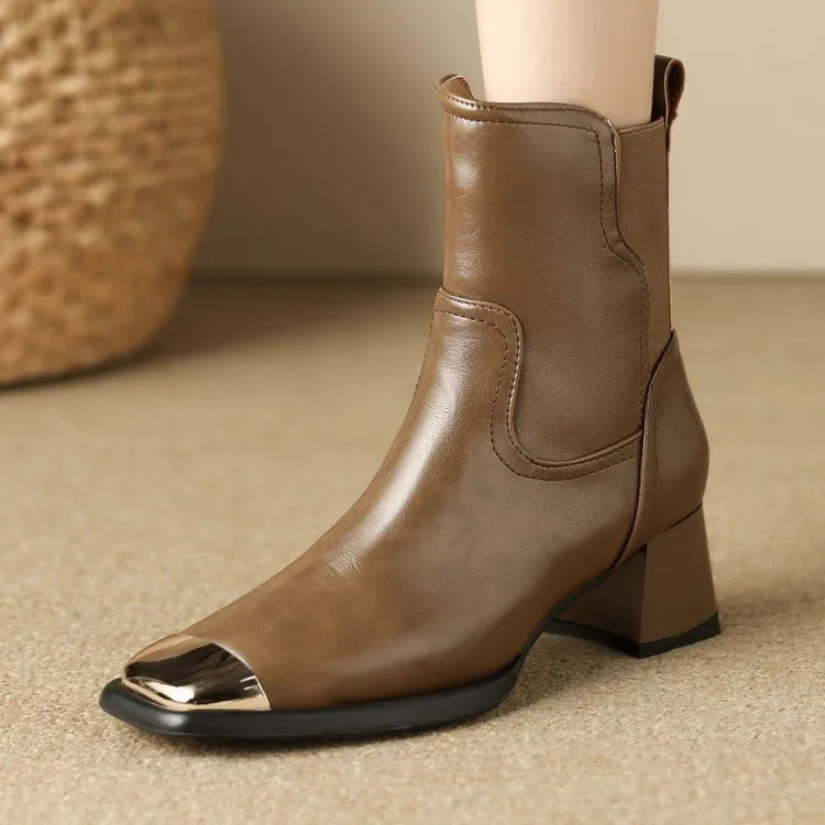 Brown women's high-heel Martin boots made of cowhide leather with a side zipper and decorative rivets.