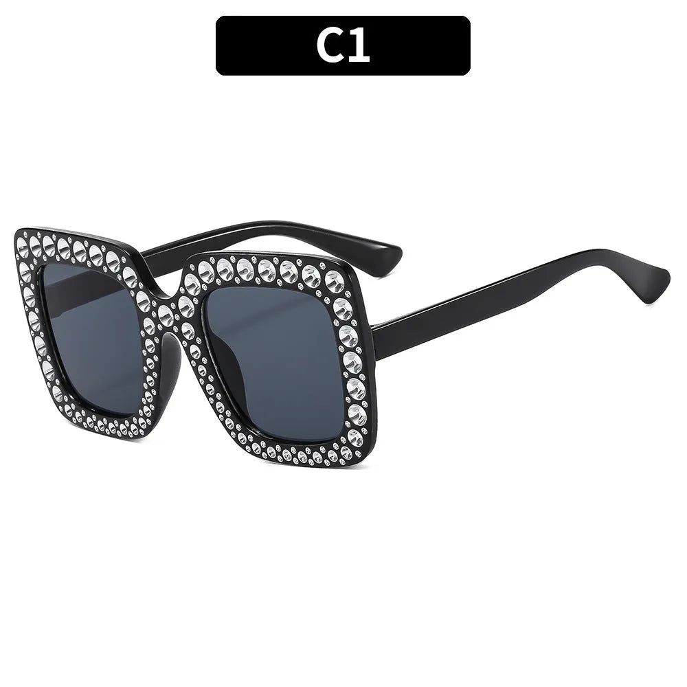 Plastic sunglasses storage box with clear transparent lid showing fashion eyewear inside