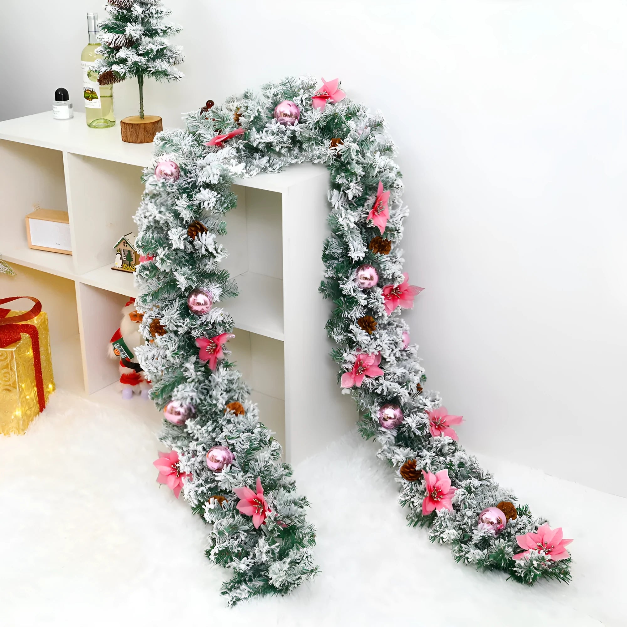 American-style PVC Christmas rattan garland with white flocking, shown draped in golden and red colour options.