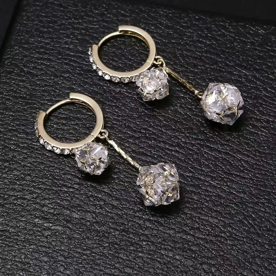 Silver drop earrings with rhinestone ball, balloon charm and tassels on ear clip fitting