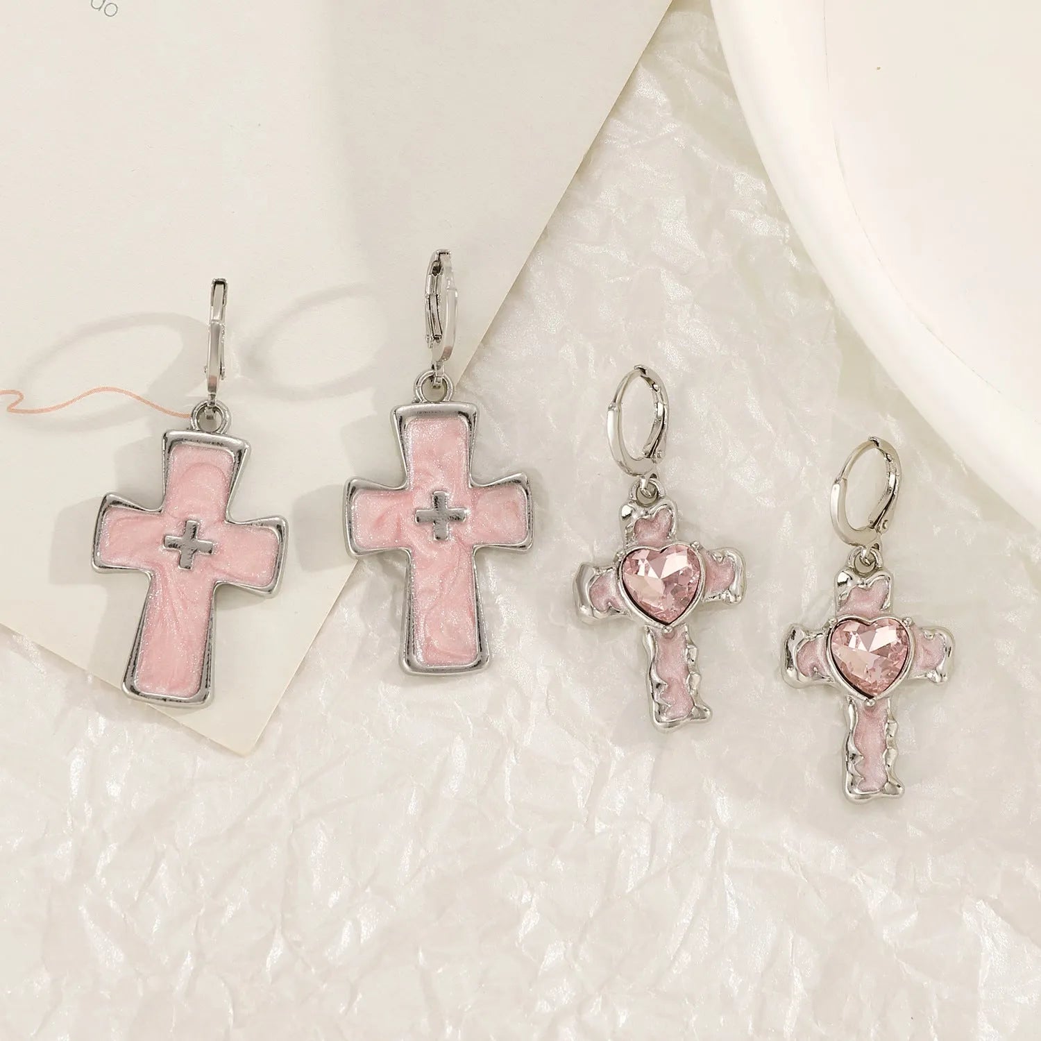 Women's alloy earrings with cross crystal design in antique silver, white, and bright black cat colour options