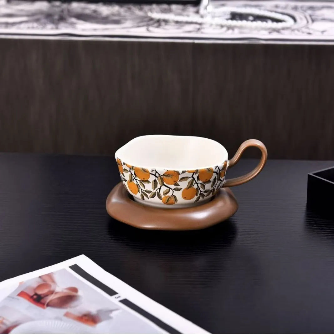 Antique style ceramic coffee cup and saucer set with medieval pattern, 210ml capacity, in black or orange.