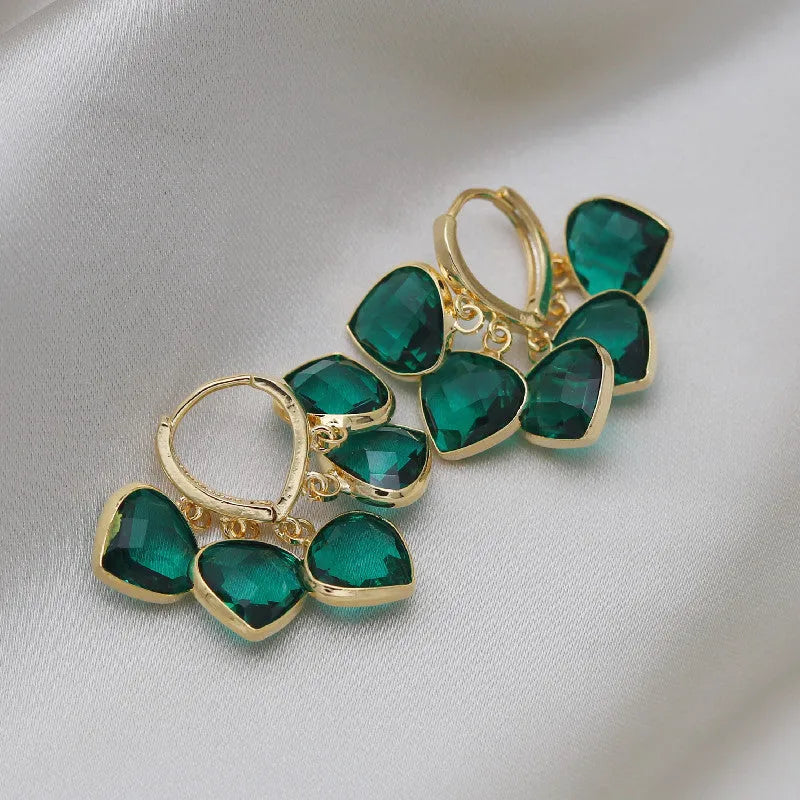 Green heart-shaped glass pendant ear clip earrings with alloy gemstone inlays on copper frame