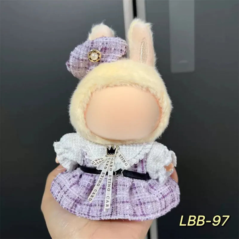Plastic outfit for a 17cm tall vinyl doll on a white background.