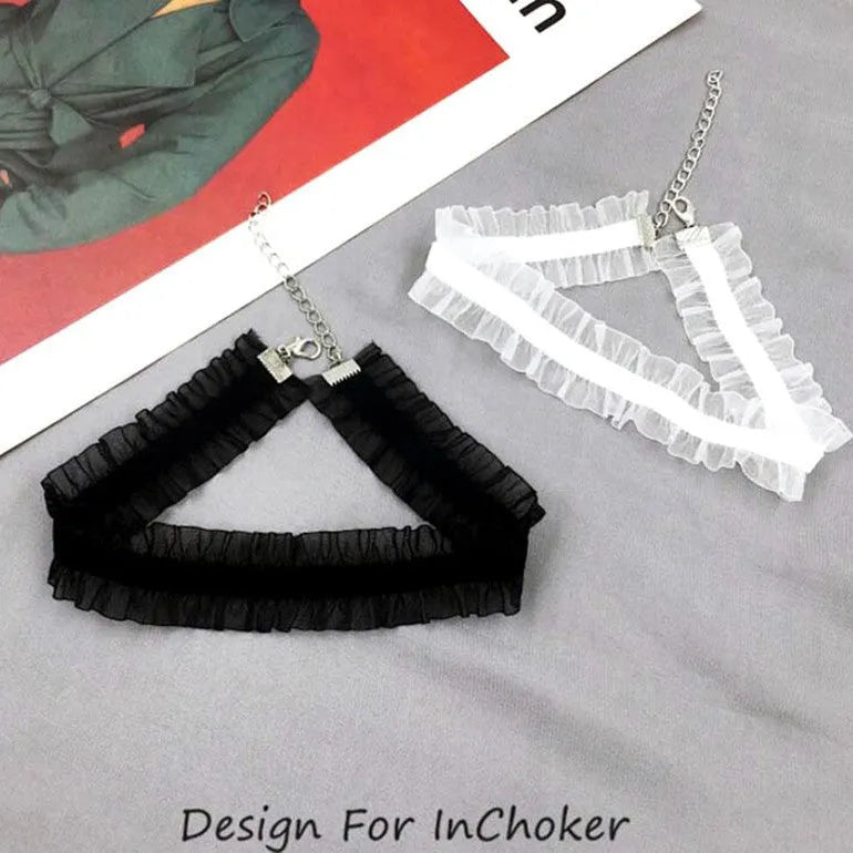 Close-up of a black velvet ruffled chain necklace with a detailed floral alloy pendant.