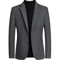Men's slim fit wool suit in a solid colour with a polyester lining, shown on a hanger.