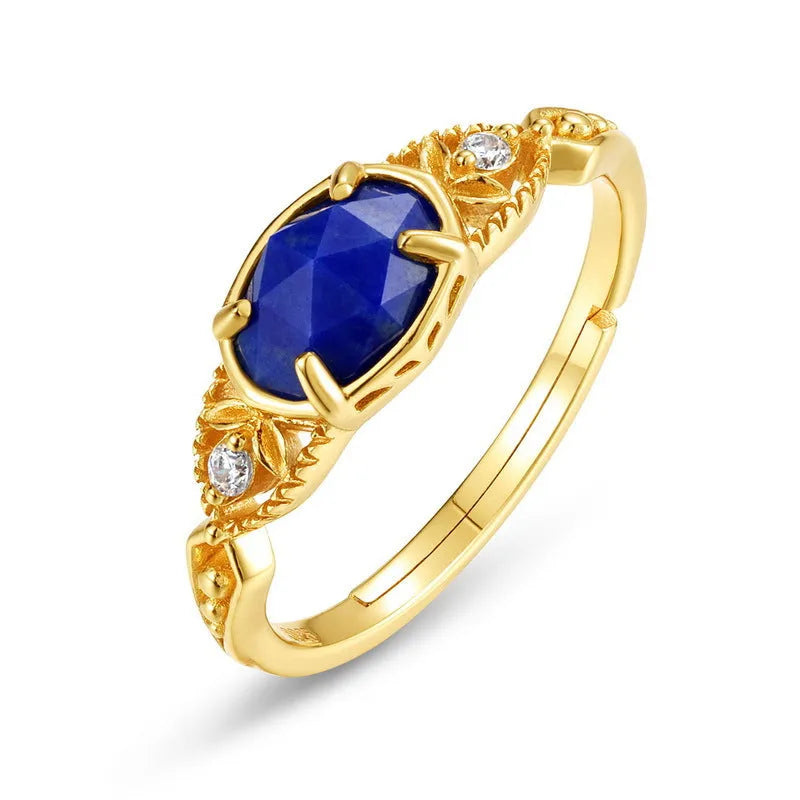 Japanese style silver alloy ring with blue lapis lazuli stone in an elliptical geometric shape.