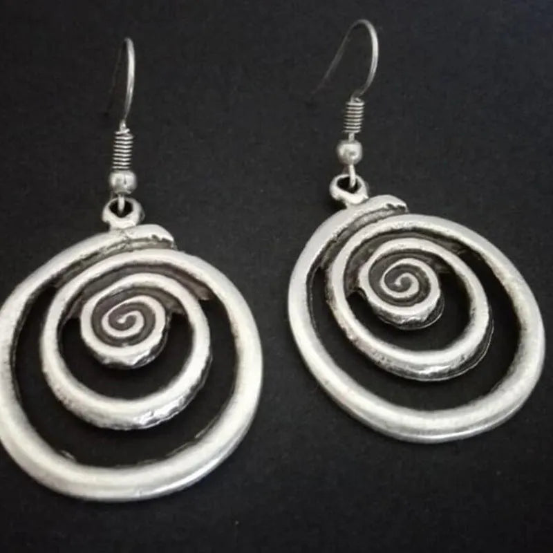 Silver geometric spiral distressed earrings with a retro national style design.