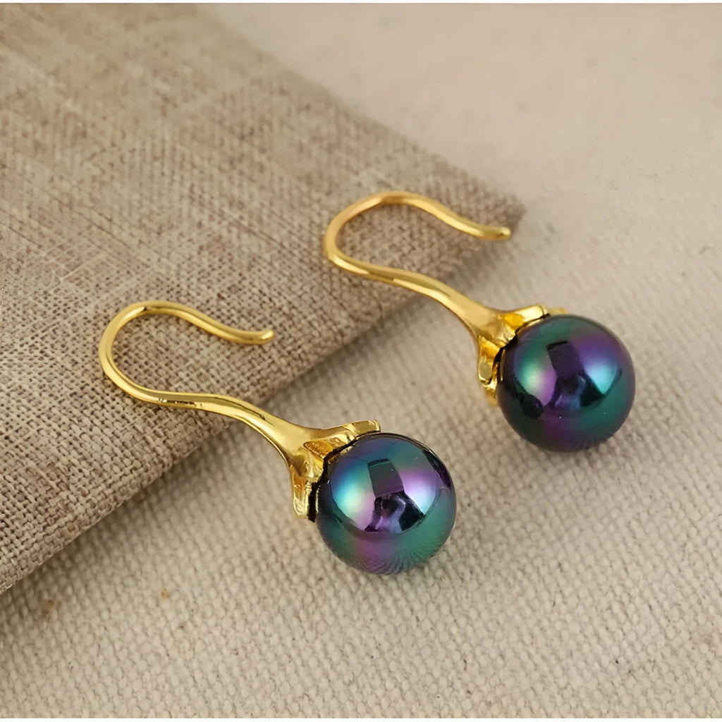 A pair of gold-colour retro fashion earrings for women with an OL style design.