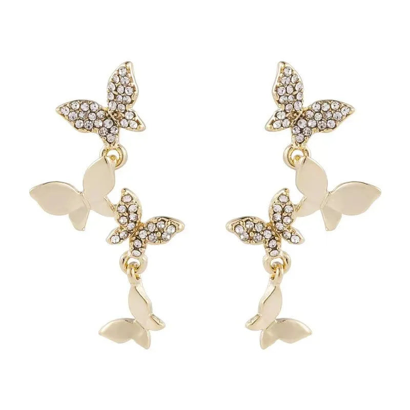 Gold-colour women's drop earrings with four butterfly charms made from copper