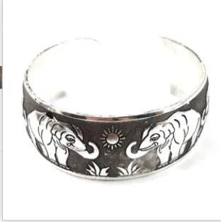 Ethnic carved open Miao silver bracelet with Roman shape in turtle colour option showing detailed openwork carving