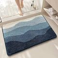 Square rainbow pattern floor mat in sky blue and white colours with a flat weave and plastic backing.