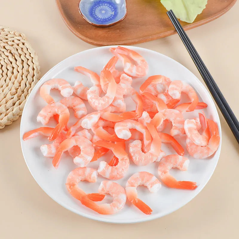 PVC injection moulded shrimp-shaped keychain and bag pendant with door buckle on white background.