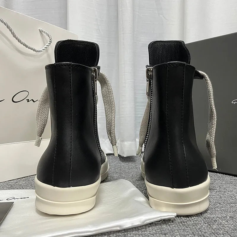 Black genuine leather high-top sneakers with a side zipper and round toe on a rubber sole.