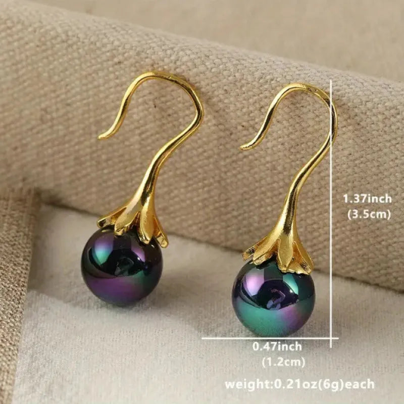 A pair of gold-colour retro fashion earrings for women with an OL style design.