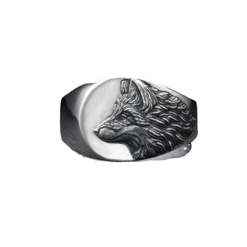 Silver alloy men's ring with a geometric wolf design on a black background.