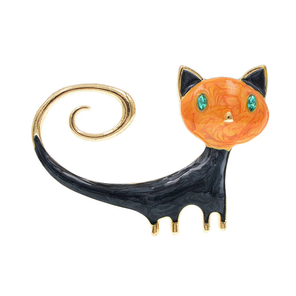 Orange and white alloy cat brooch with painted tail detail and pin fastener.