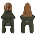 A small dog wearing a khaki-colour British-style waterproof shell jacket with an adjustable belly strap.