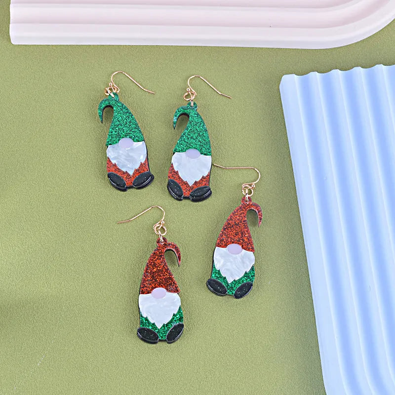 Acrylic cartoon Santa Claus earrings showing red, green, and red/green hat style options.