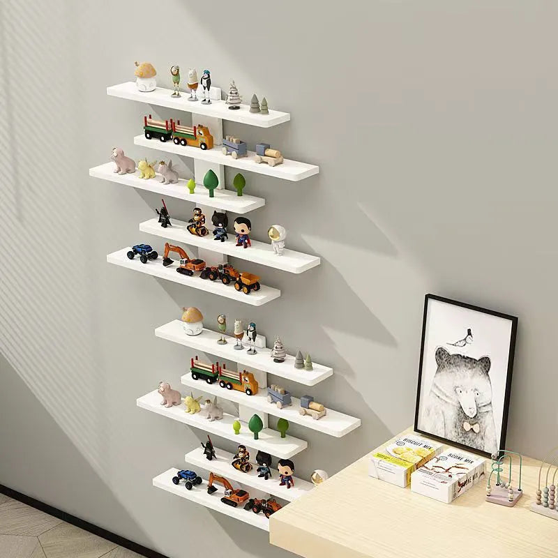 White 5-tier PVC wall-mounted rack displaying toy dolls and blind boxes.