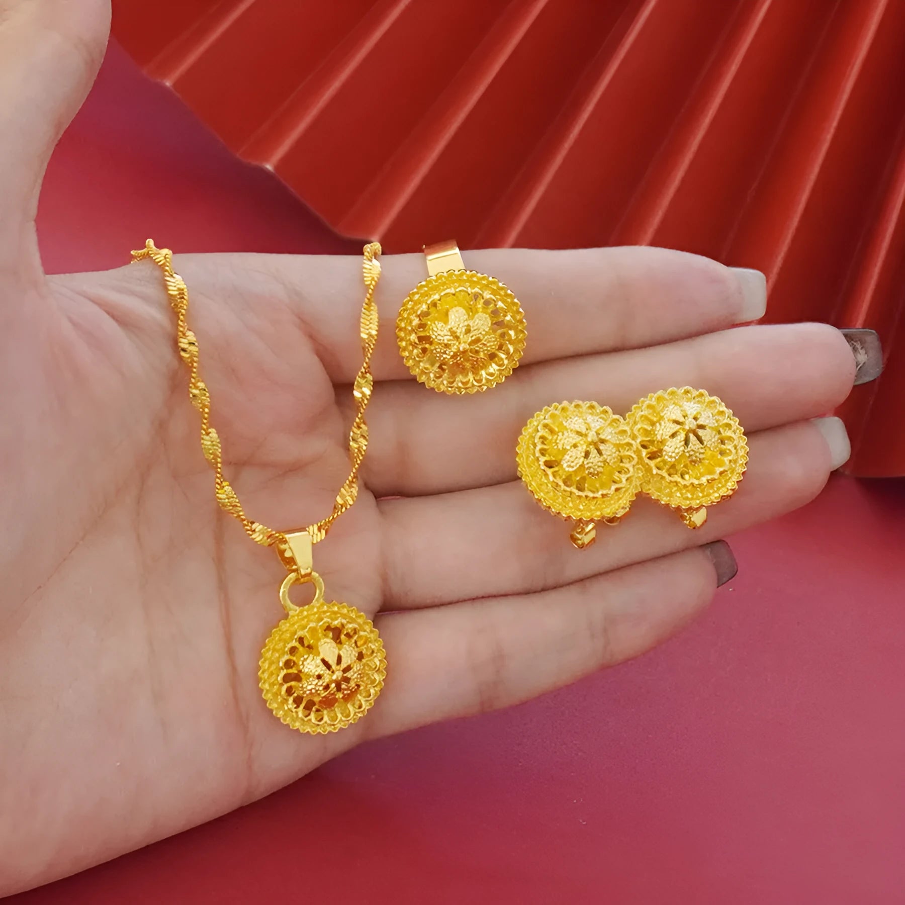 Landscape Middle East gold-plated floral jewellery three-piece set showing necklace, earrings and ring