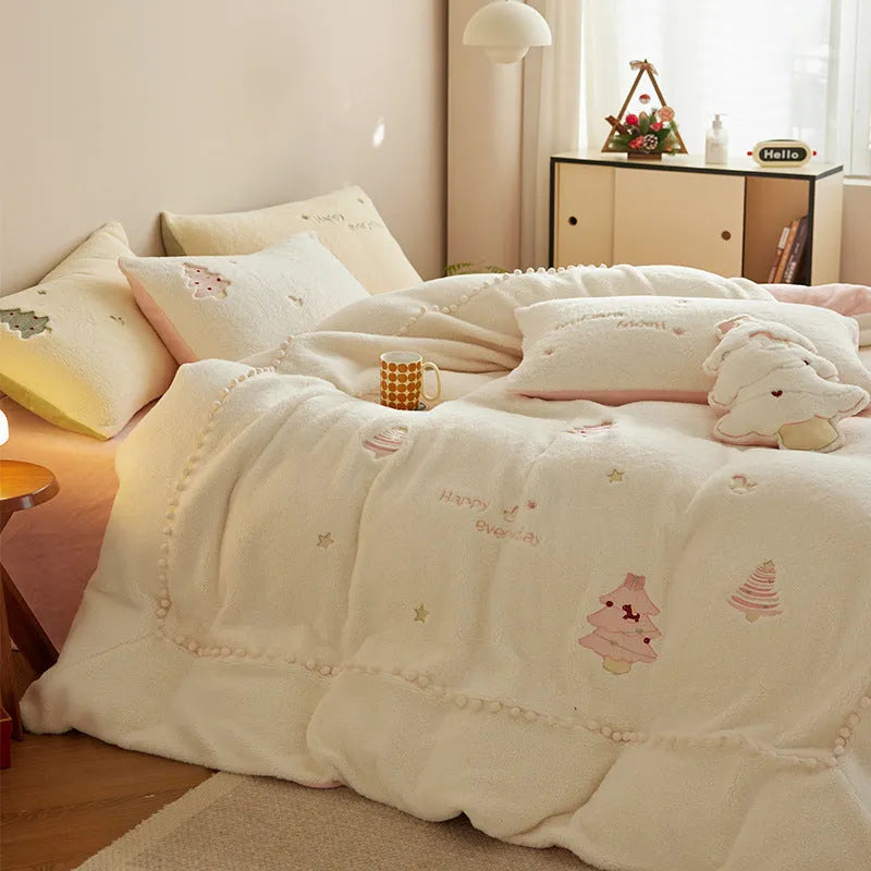 Winter milk fibre bedding four-piece set with green Christmas tree pattern on a bed.
