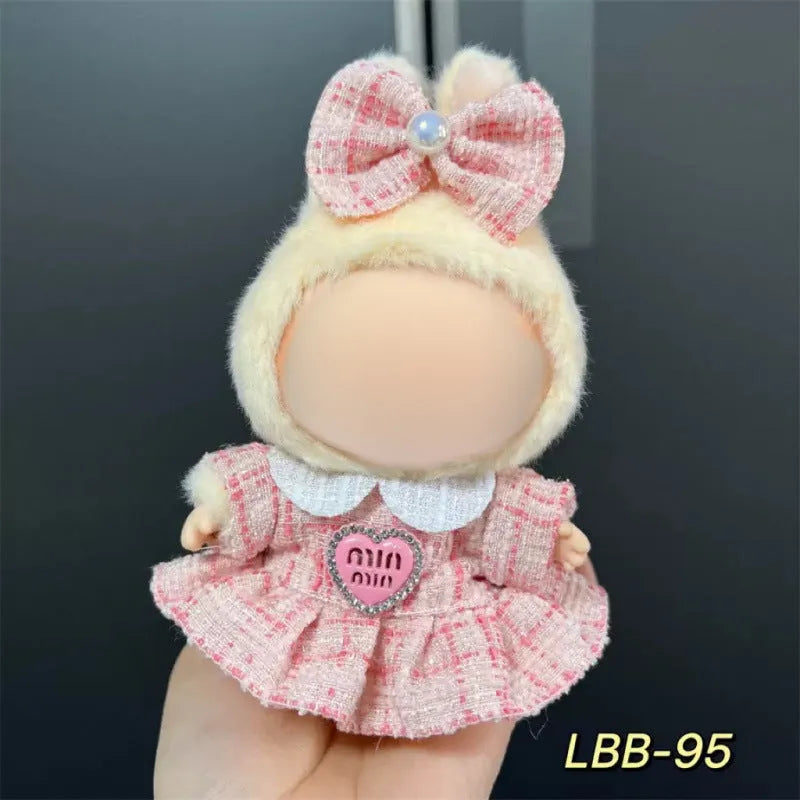 Plastic outfit for a 17cm tall vinyl doll on a white background.