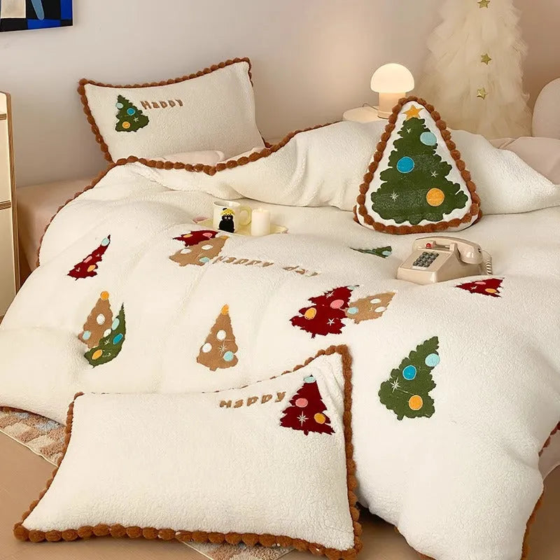 Bright yellow fleece-lined duvet cover with embroidered Christmas cartoon trees on a bed.
