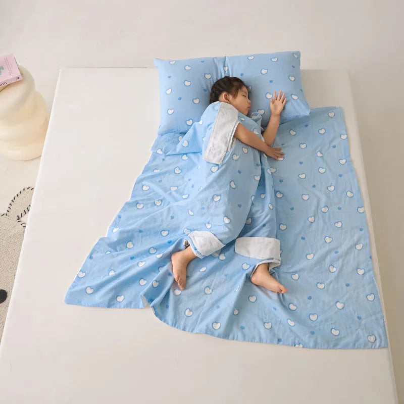 Anti-kick sleeping bag blanket in a choice of colours and sizes on a bed.