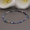 Handmade adjustable women's bracelet with colourful geometric glass and semi-precious stone beads in Bohemian style.