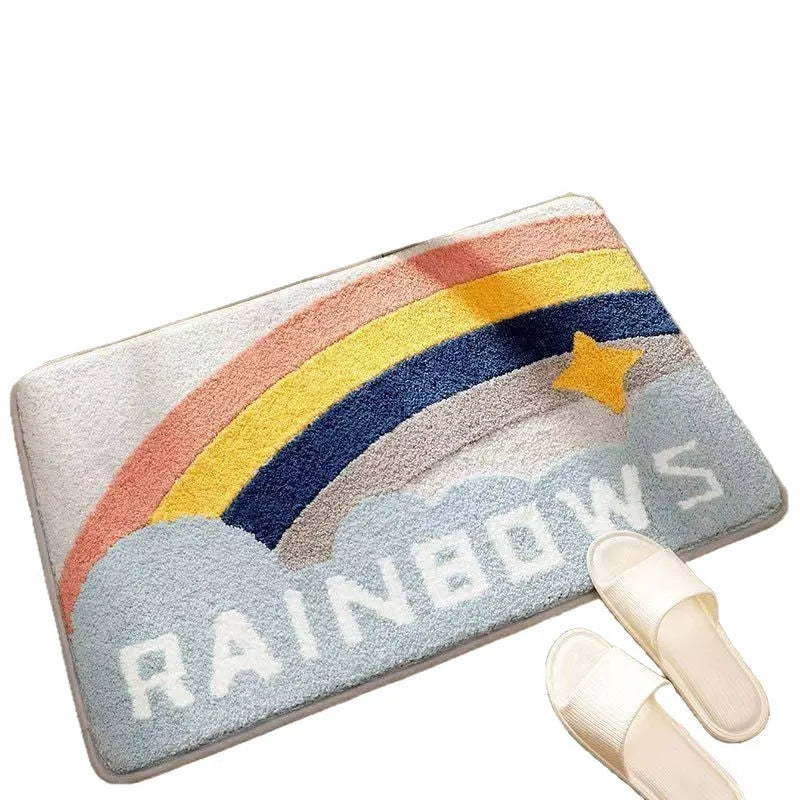 Square rainbow pattern floor mat in sky blue and white colours with a flat weave and plastic backing.