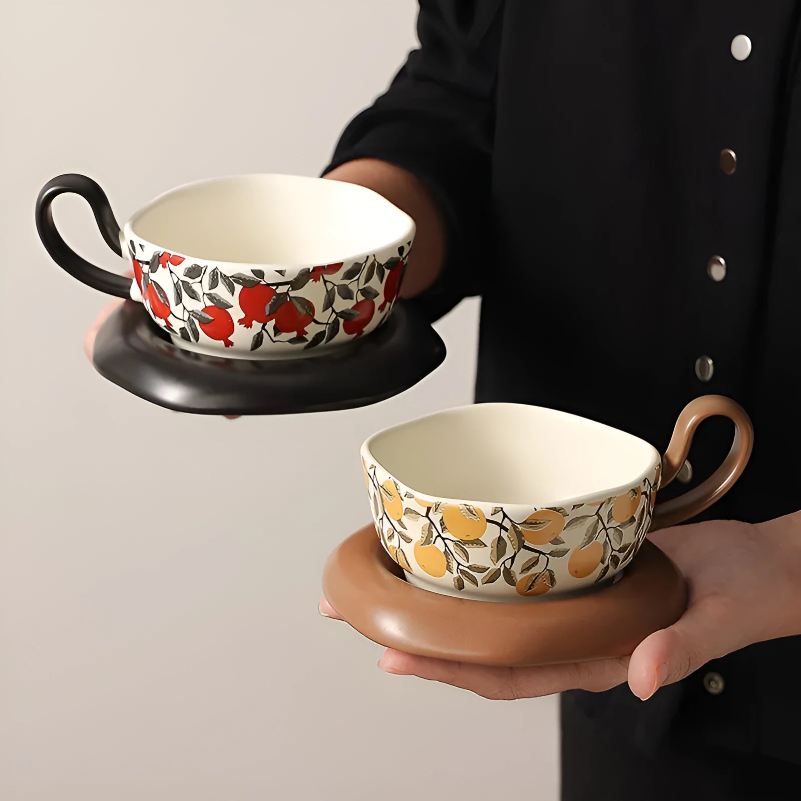 Antique style ceramic coffee cup and saucer set with medieval pattern, 210ml capacity, in black or orange.