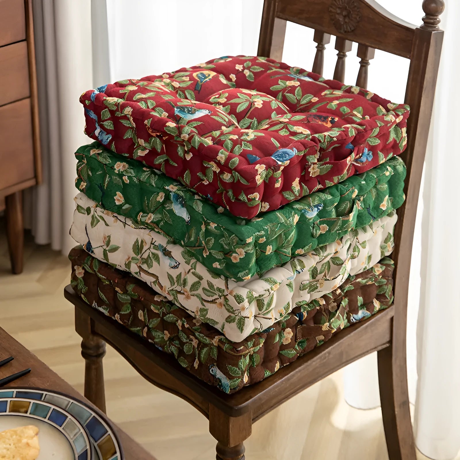 American-style square dining chair cushion with thick padding and botanical print.