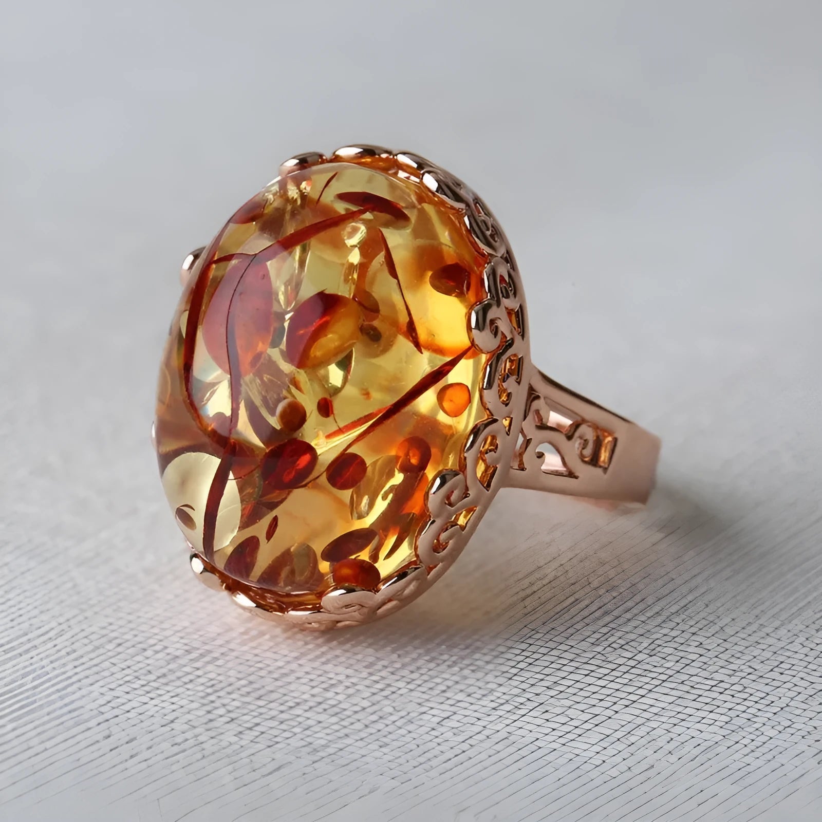 Ethnic style amber beeswax ring for women with a retro design and complimentary alloy band.