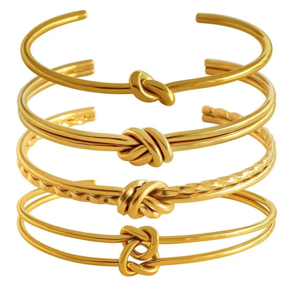 Women's adjustable knotted C-shaped bracelet in stainless steel with gold plating