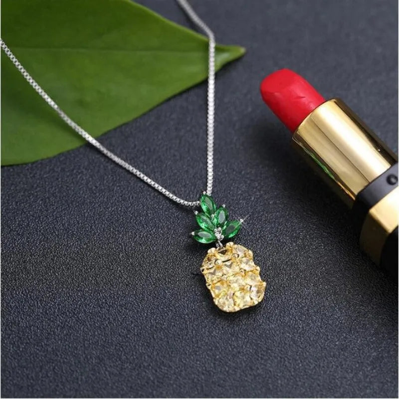 Silver-plated women's necklace with a geometric pineapple diamond charm in a copper white gold finish.