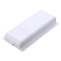 White plastic under-table storage drawer with magnetic adhesive backing and internal grid compartment