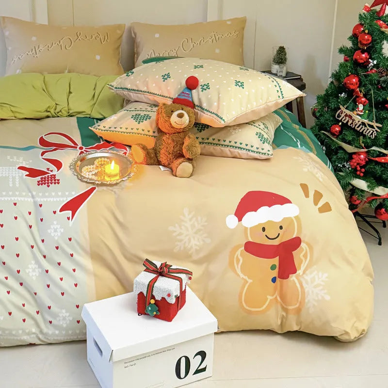 Cartoon Christmas duvet cover and pillowcase set in red and green on a bed.